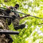 which is the safest device to use while climbing a tree or in a tree stand?
